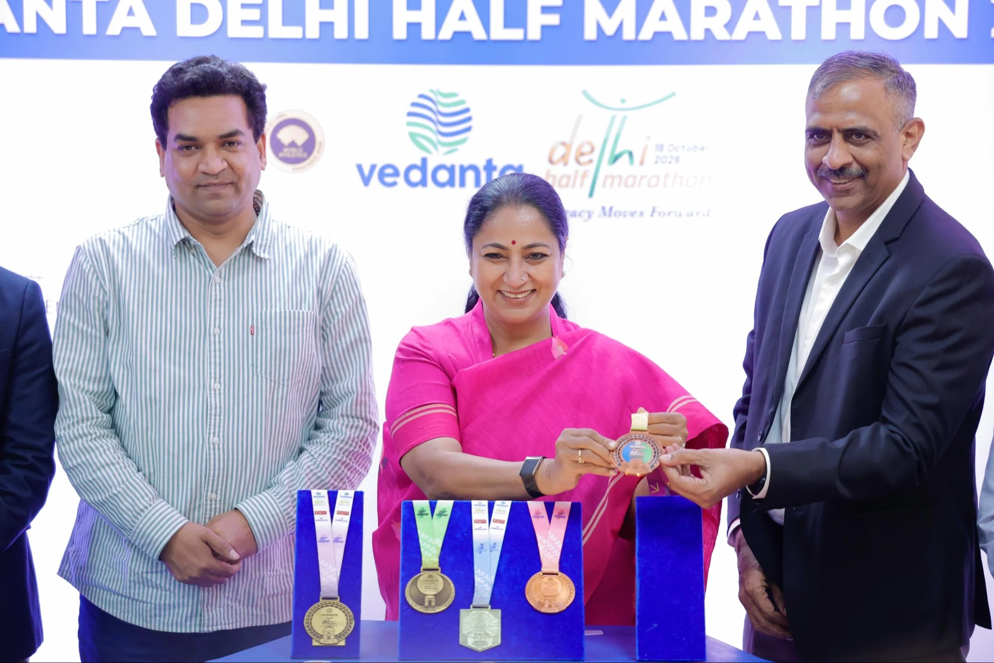 Delhi CM Rekha Gupta unveils Vedanta Delhi Half Marathon Finisher's Medal